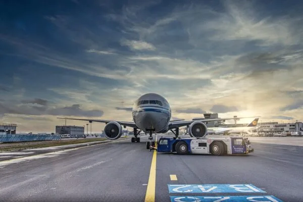 Commercial airplane on the tarmac at DTW, highlighting professional Detroit Metro Airport taxi & limo transfer services.